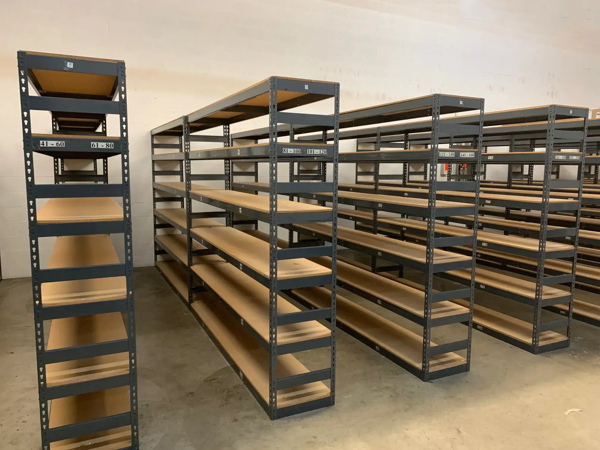 empty boltless shelving inside of a warehouse