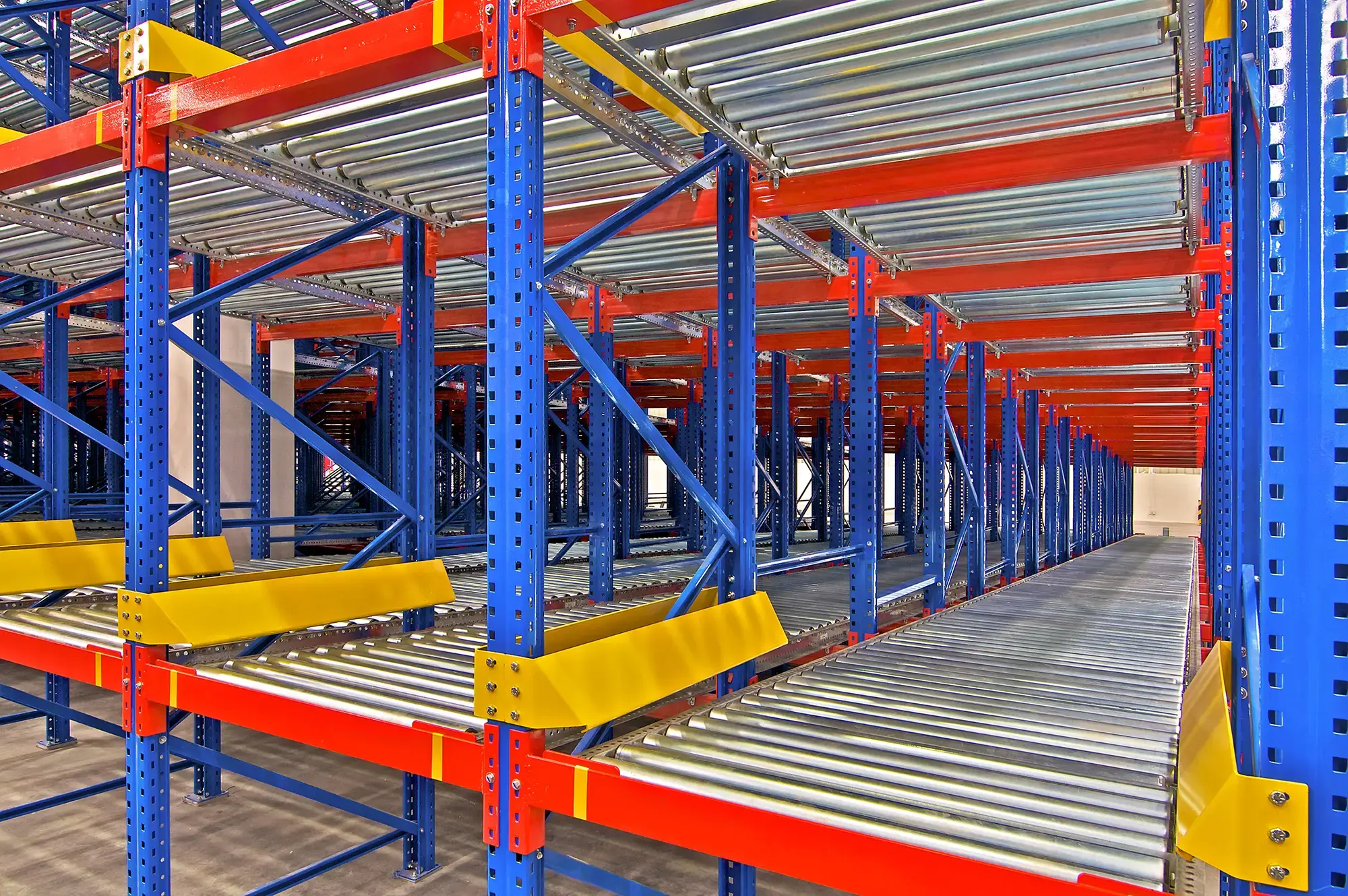 empty pallet flow racking inside of a warehouse